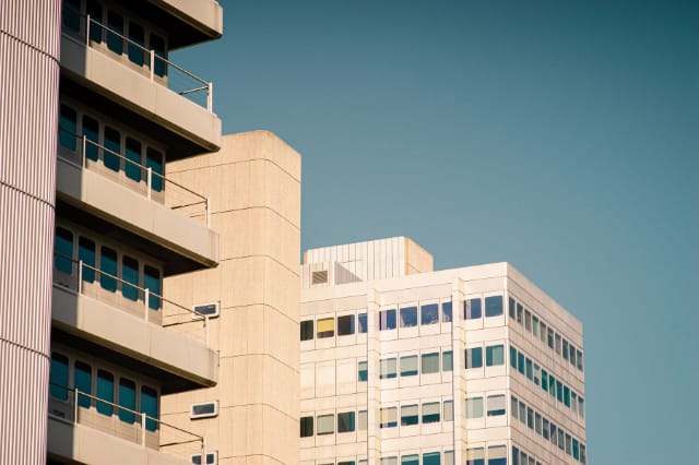 Office buildings reflecting wealth-building strategies through commercial property Office buildings reflecting wealth-building strategies through commercial property