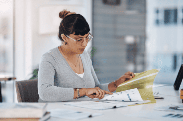 Trustee reviewing SMSF refinance documents for planning and compliance Trustee reviewing SMSF refinance documents for planning and compliance