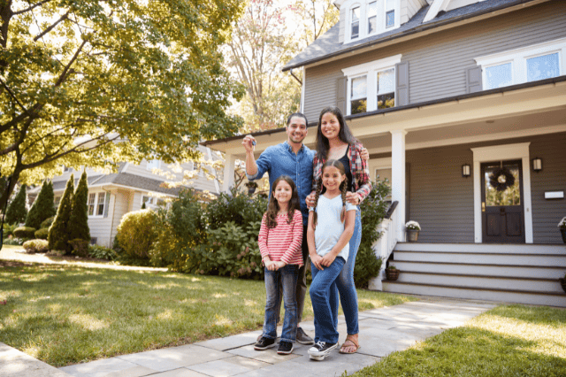 Doctor and family in front of home, suggesting outcomes possible under specialist lending policies Doctor and family in front of home, suggesting outcomes possible under specialist lending policies