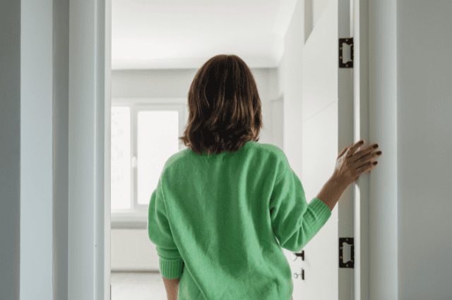 Medical specialist entering new home, marking a key stage in property finance journey Medical specialist entering new home, marking a key stage in property finance journey