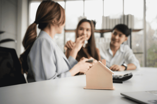 Couple meeting broker to explore educator home loans and first home buyer strategies Couple meeting broker to explore educator home loans and first home buyer strategies
