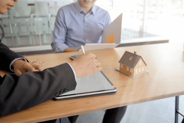 Mortgage broker reviewing home loan options for a self-employed teacher Mortgage broker reviewing home loan options for a self-employed teacher